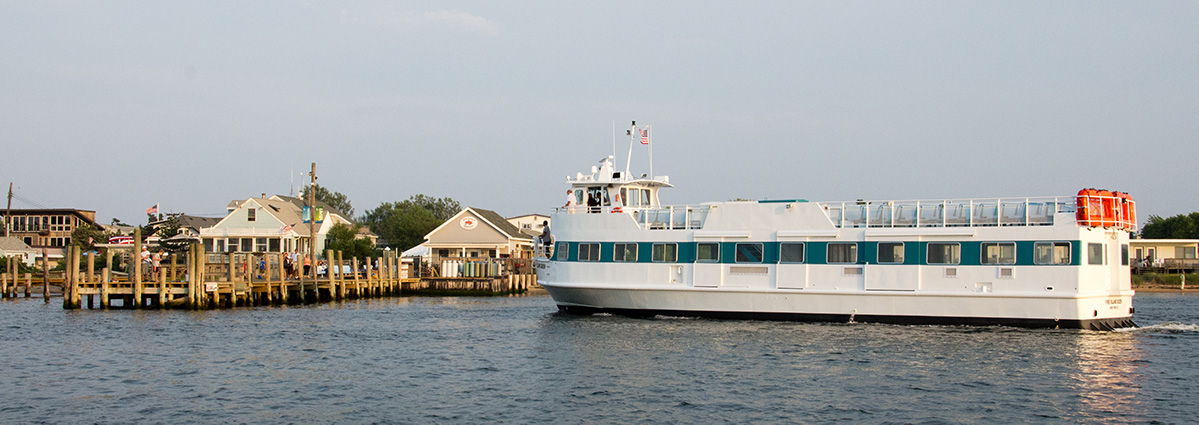 Kismet bayfront / marina, ferry visible, late afternoon