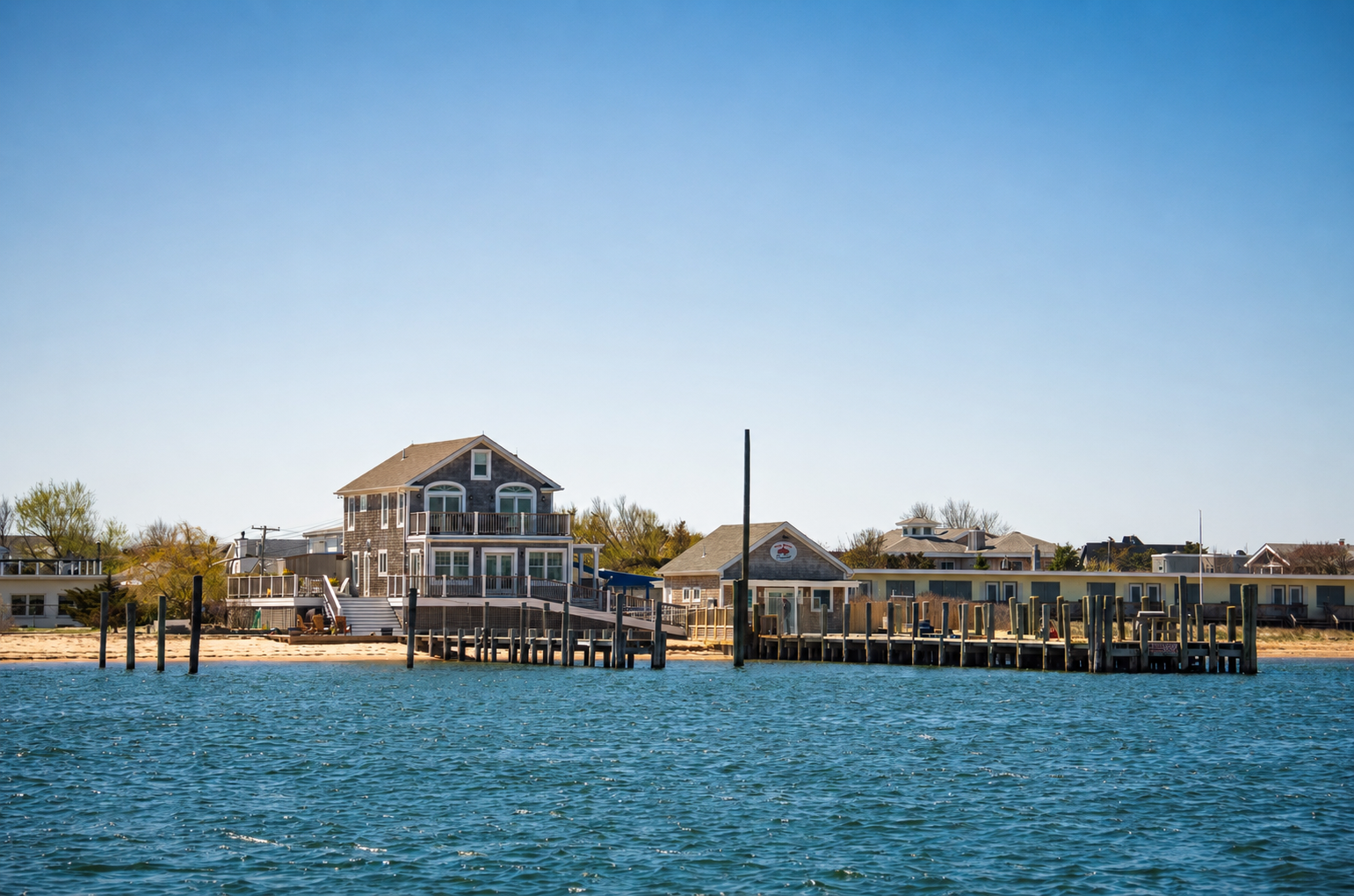 Kismet bayfront / marina, ferry visible, late afternoon